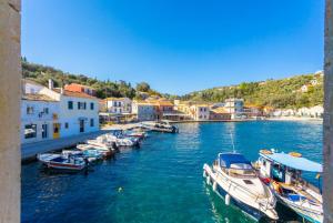 a group of boats are docked in a harbor at Spiros Jetty House in Longós