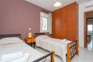 Postel nebo postele na pokoji v ubytování Villa Mary + 37 fotografií