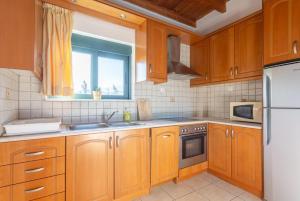 Kuchyň nebo kuchyňský kout v ubytování Andreas Beach Villa