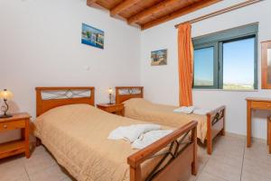 Postel nebo postele na pokoji v ubytování Andreas Beach Villa