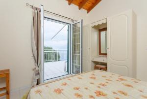 Postel nebo postele na pokoji v ubytování Villa Thalassa