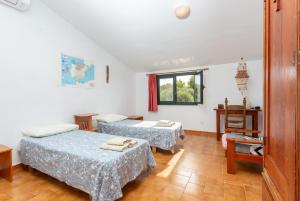 Postel nebo postele na pokoji v ubytování Villa Bini Estrella + 35 fotografií