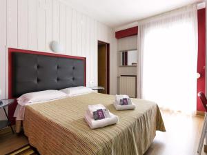 Postel nebo postele na pokoji v ubytování Hostal Fabrellas