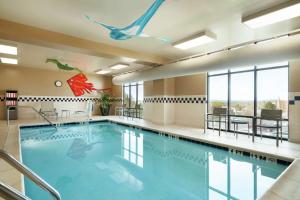 a pool in a hotel room with a swimming pool at Hampton Inn & Suites Ephrata - Mountain Springs in Ephrata