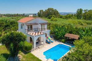 an aerial view of a villa with a swimming pool at Sun Beach Villa Thio in Polis Chrysochous