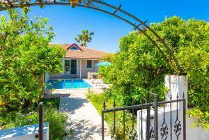 a villa with a swimming pool and a gate at Villa Duman 1 in Dalyan