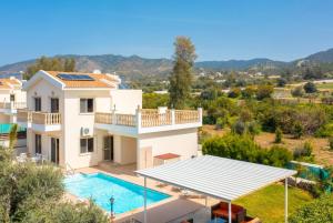 an image of a villa with a swimming pool at Villa Rose in Paphos