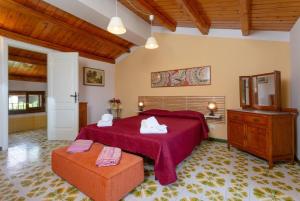 a bedroom with a bed and a dresser with towels at Villa Palazzola in Scicli +49 photos
