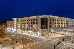 a large building at night with a street in front at DoubleTree by Hilton Evansville in Evansville