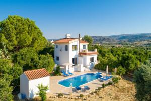 an image of a villa with a swimming pool at Villa Charoula Tessera in Polis Chrysochous