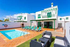 an image of a villa with a swimming pool at Villa Costa Papagayo 5 in Playa Blanca