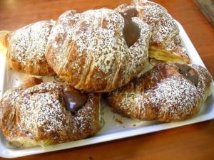 a white plate of pastries on a table at B&B Emily Brindisi in Brindisi