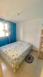 a bedroom with a bed in a room at Apartamento Compacto Mobiliado in Natal