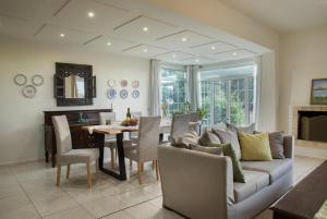 a living room with a couch and a table at Villa Armi in Episkopi