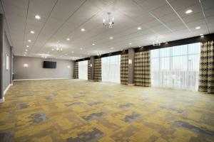 a large room with a large room with a projection screen at Homewood Suites By Hilton Florence in Florence