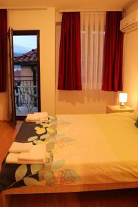 a bedroom with a bed with a glass table at Apartmani Marija in Ohrid