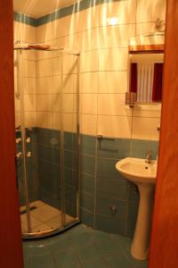 a bathroom with a shower and a sink at Apartmani Marija in Ohrid