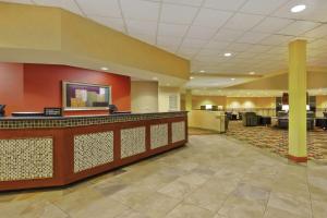 a lobby of a hotel with a reception desk at DoubleTree by Hilton Holland in Holland