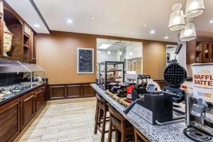 a view of the front counter of a restaurant with a coffee shop at Hilton Garden Inn Gainesville in Gainesville