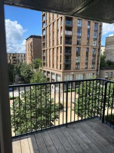 a balcony with a view of a building at Luxury one bedroom apartment in London