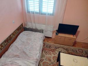 Ein Bett oder Betten in einem Zimmer der Unterkunft Vila Goca
