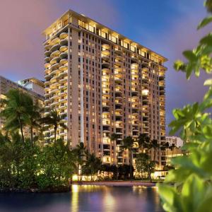 a large building with lights on the side of it at Hilton Grand Vacations Club at Hilton Hawaiian Village in Honolulu