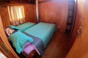 Ένα ή περισσότερα κρεβάτια σε δωμάτιο στο Casa en playa de Llico, Vichuquén