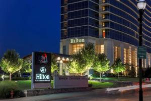 a hotel with a hilton sign in front of a building at Hilton Branson Convention Center in Branson