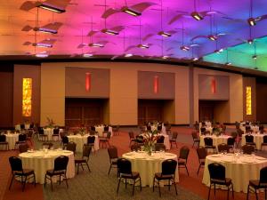 a banquet hall with tables and chairs and purple lighting at Hilton Branson Convention Center in Branson