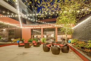 a courtyard with chairs and lights in a building at DoubleTree by Hilton Huntington, WV in Huntington