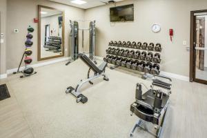 a gym with dumbbells and exercise equipment at DoubleTree by Hilton Huntington, WV in Huntington