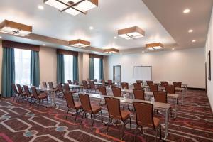 a conference room with tables and chairs and a whiteboard at Homewood Suites by Hilton North Houston/Spring in Spring +27 photos