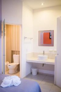 Ένα ή περισσότερα κρεβάτια σε δωμάτιο στο HOTEL OBREGON