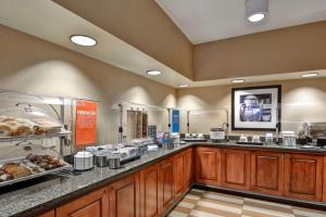 a cafeteria with a counter with aasteryasteryasteryasteryasteryasteryasteryasteryastery at Hampton Inn Jacksonville - I-95 Central in Jacksonville