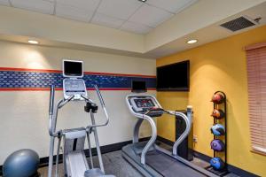 a gym with two exercise machines in a room at Hampton Inn Jacksonville - I-95 Central in Jacksonville