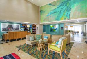 a lobby with a waiting room with couches and a table at Hampton Inn Jacksonville South/I-95 at JTB in Jacksonville