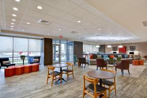 an office with tables and chairs and a waiting room at Home2 Suites By Hilton Lafayette in Lafayette