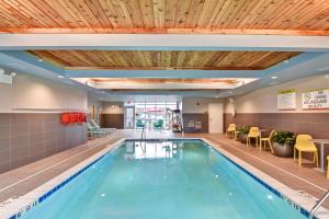 a swimming pool in a hotel room with at Home2 Suites By Hilton Lafayette in Lafayette