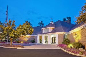 a house with a driveway in front of it at Homewood Suites Lafayette in Lafayette