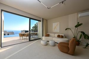 a living room with a couch and a large window at Villa Rosemary 2 in Makarska