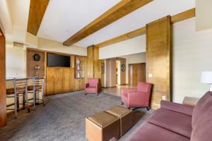 a living room with a couch and a table at Hilton Vacation Club Cancun Resort Las Vegas in Las Vegas