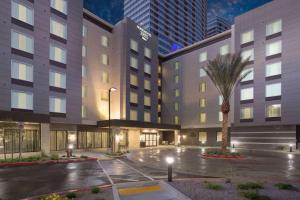 a rendering of the front of a hotel at night at Homewood Suites By Hilton Las Vegas City Center in Las Vegas