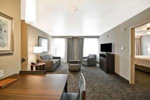 a living room with a couch and a bed at Homewood Suites By Hilton Las Vegas City Center in Las Vegas