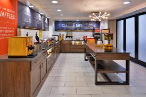 a fast food restaurant with a large kitchen with counters at Hampton Inn & Suites Las Vegas Airport in Las Vegas