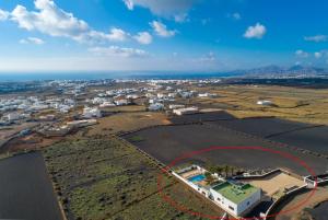 an aerial view of a town with a red circle at Villa Santana in Conil