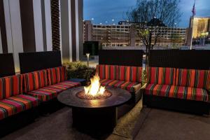 a fire pit with two couches and a table at Home2 Suites by Hilton Las Vegas Stadium District in Las Vegas