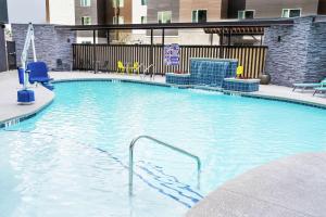 a large swimming pool in a hotel room at Home2 Suites by Hilton Las Vegas Stadium District in Las Vegas