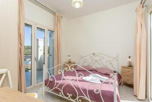 A bed or beds in a room at Katelios Villas Collection Még 30 kép