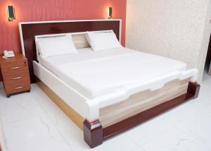 Postel nebo postele na pokoji v ubytování HOTEL MAVILLA Cotonou