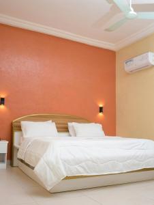 Postel nebo postele na pokoji v ubytování HOTEL MAVILLA Cotonou